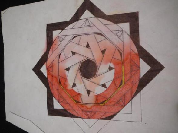 Eight pointed star made using only one line that overlaps and connects to itself. The star was red, but the paper it was drawn on got water damage, bleeding the color