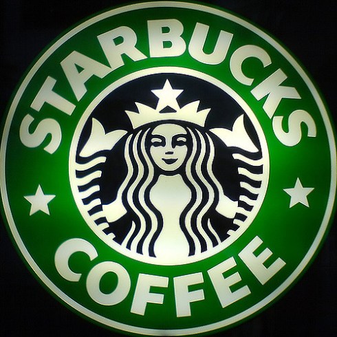 She's smiling because she's getting rich off your ignorance and addiction Picture of the Starbucks logo