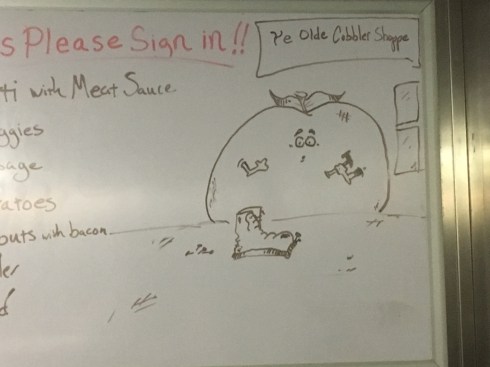 Picture of a peach using a hammer to fix an old fashioned shoe. Above him is a sign that reads, "Ye Olde Cobbler Shop."