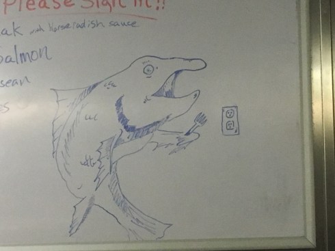 Picture of a salmon holding a fork, preparing to stick it in an electric socket