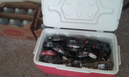 Now that's what I call, "disaster relief." Photo of an ice chest full of random brands of beer bottles